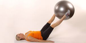 Holding the gymnastic ball between the raised legs develops bottom compression